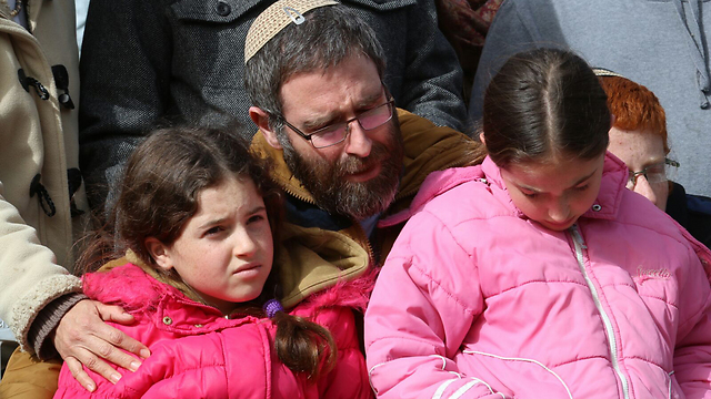 Natan Meir and two of the Meirs' daughters (Photo: Hillel Meir/TPS)