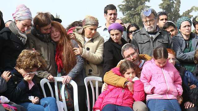 The grieving family at the funeral (Photo: TPS)