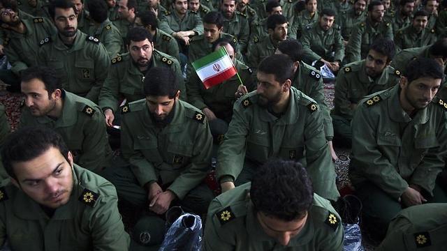 Members of the Revolutionary Guard attend the anniversary ceremony of Iran's Islamic Revolution at the Khomeini shrine in the Behesht Zahra cemetery, south of Tehran, February 1, 2012. (Photo: Reuters) (Photo: Reuters)
