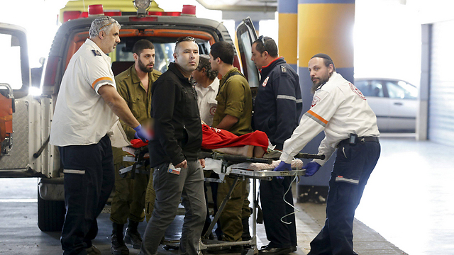 Wounded being taken to hospital after Focus checkpoint attack (Photo: Reuters)