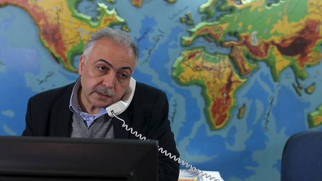 Palestinian travel agent Nabil Shurafa speaks on a phone at his office in Gaza City (Photo: Reuters)