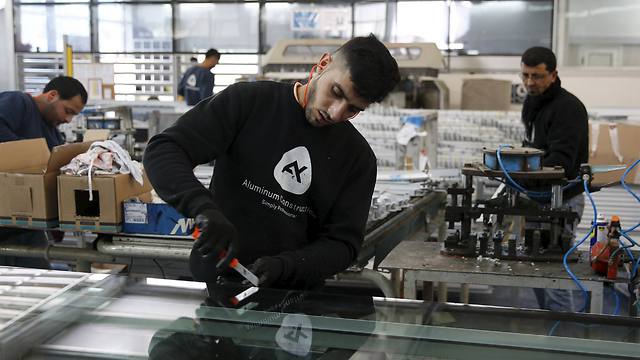 Palestinian workers at an Israeli West Bank factory. (Photo: Reuters)