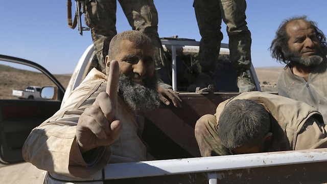 ISIS fighters captured by Syrian rebels (Photo: Reuters)
