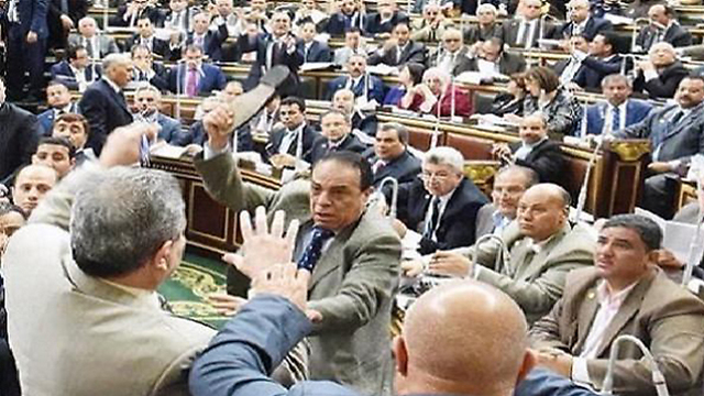 Shoe hurled at Okasha at the Egyptian parliament.