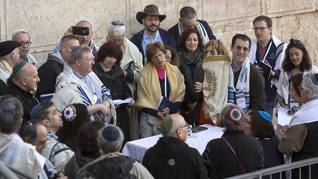 American Reform Rabbi, Zachary Shapiro, center right, and other American and Israeli Reform rabbis pray in the Western Wall