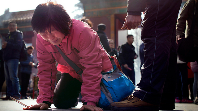 כאב המשפחות, היום בבייג'ינג (צילום: AP) (צילום: AP)