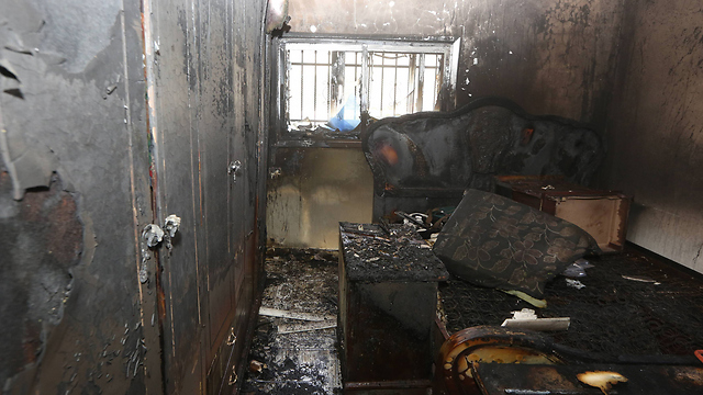 The arsoned home in Duma