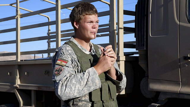 ג'ון קול עם כוחות הפשמרגה בעיראק (צילום: רויטרס) (צילום: רויטרס)