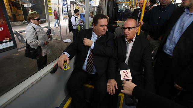 Transport Minister Yisrael Katz (left) riding a bus (Photo: Shaul Golan)