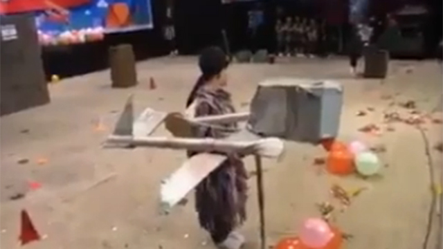 Children with a fake drone in a play in Gaza