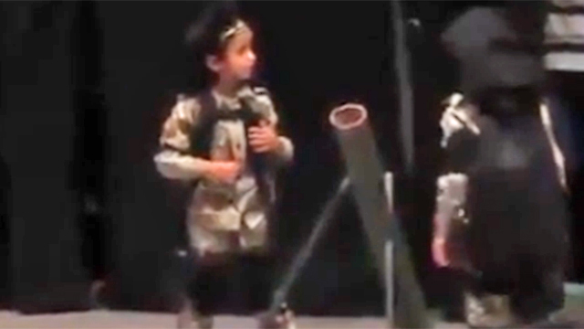 Children firing a pretend mortar in a play in Gaza