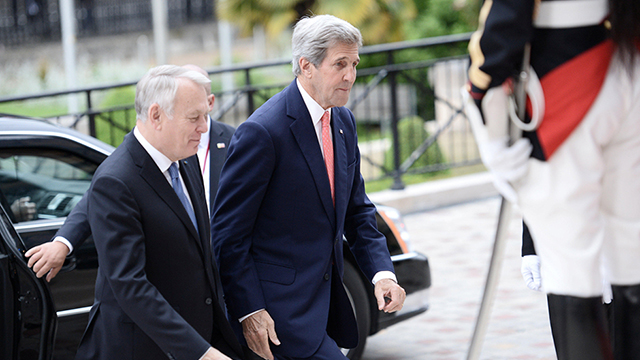 Kerry, who was hoping for good tidings from Jerusalem but received none, arriving at the Paris conference (Photo: Reuters)