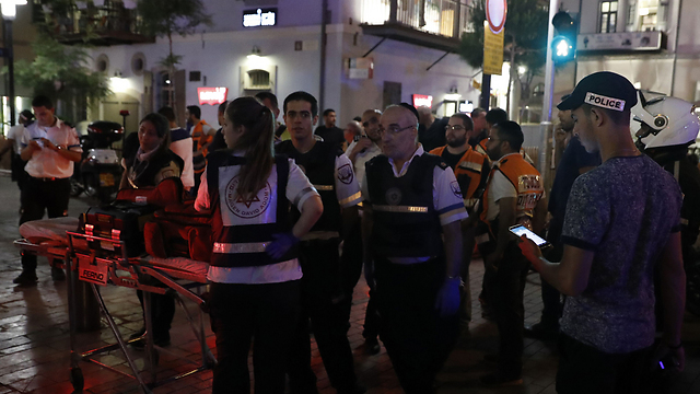 Scene from the Sarona attack (Photo: AFP)