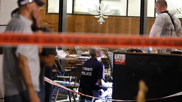 Scene of the terror attack at Sarona (Photo: AFP)