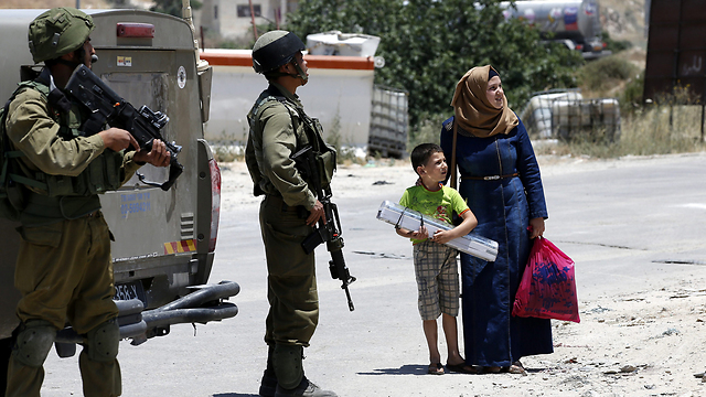 IDF soldiers in Yatta, the village the terrorists are from (Photo: EPA)