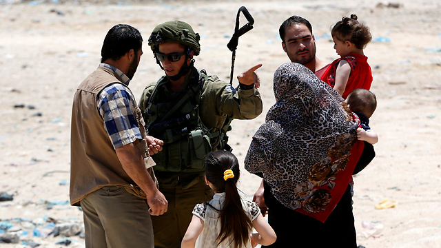 IDF soldiers in Yatta, the village the terrorists are from (Photo: Reuters)