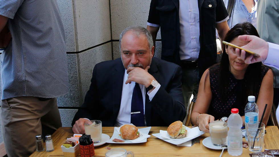 Lieberman visiting Sarona Thursday (Photo: AFP)