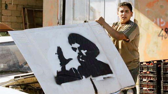 Hassan Nasrallah stencil (Photo: AP)