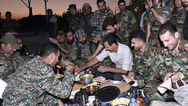 Assad and his troops breaking the Ramadan fast