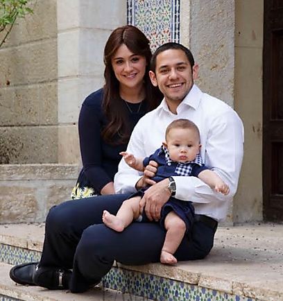 Neuman with wife, Chani, and son, Yaakov Shmuel (Photo: Emuni Z)