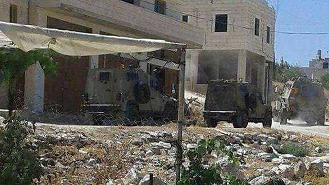 Security forces in the village of Bani Na'im, where the terrorist came from.