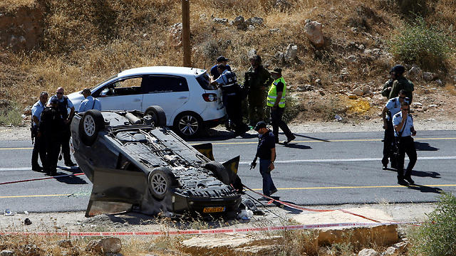 The Marks' flipped car (Photo: Reuters) 