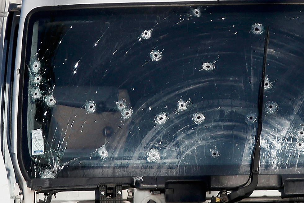 Van full of police bullet holes (Photo: Reuters)