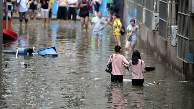 מיליונים פונו מבתיהם, 91 נעדרים. שיטפונות בסין (צילום: AFP) (צילום: AFP)