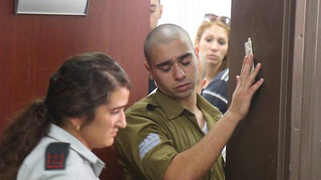 Sgt. Elor Azaria forced to leave the room under pressure of questioning (Photo: Motti Kimchi)
