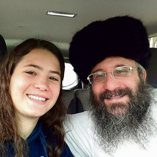 Tehila with her father, Rabbi Miki Mark.