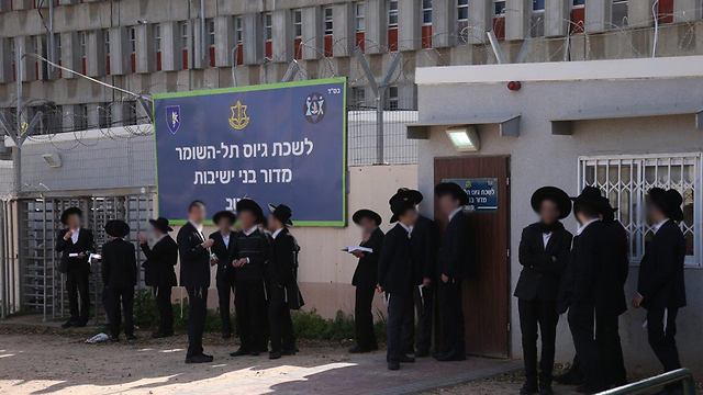 Young Haredi men standing outside the IDF's induction center (Photo: Motti Kimchi) (Photo: Motti Kimchi)