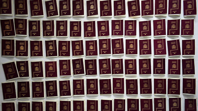 Some of the seized fake passports. (Photo: AFP)