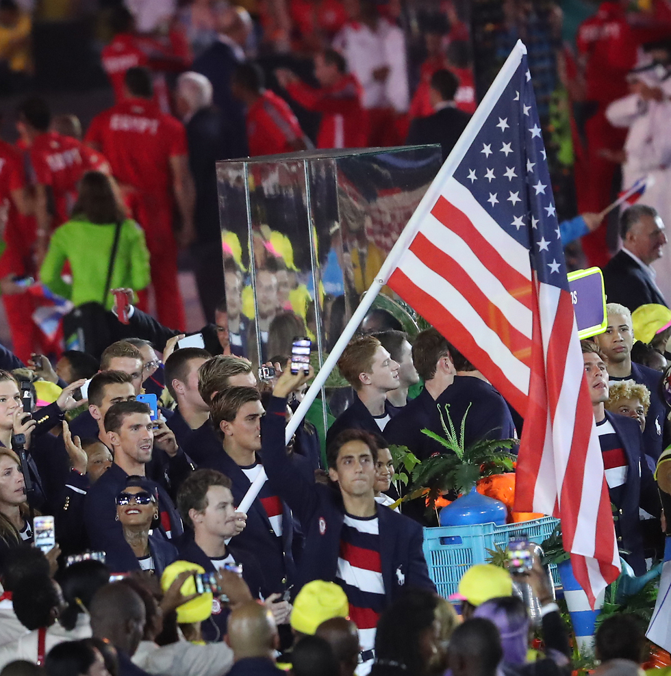 The American delegation, with record-breaking Olympic swimmer Michael Phelps carrying the flag. (Photo: Oren Aharoni)