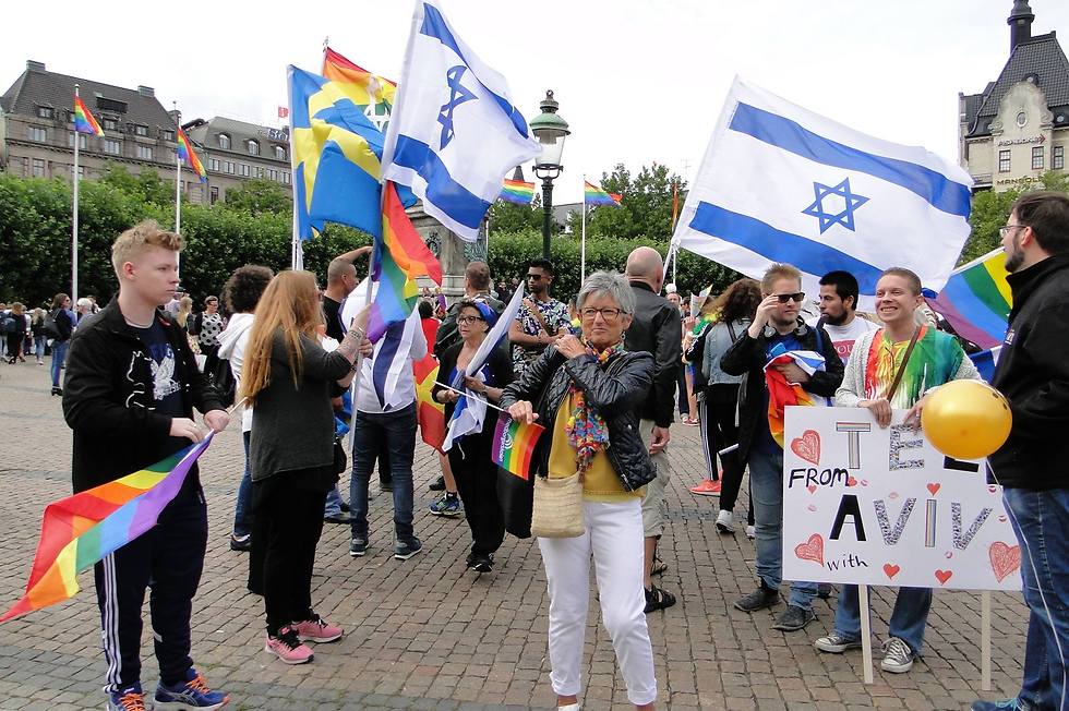Israeli and Swedish flags at the Malmo LGBT march