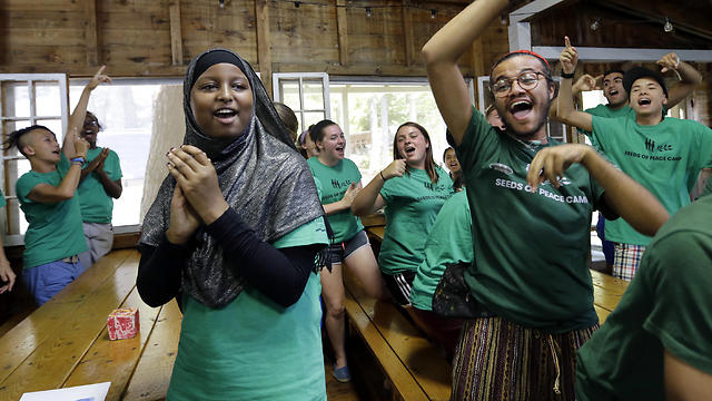 Teens celebrate victory in a competition. (Photo: AP)
