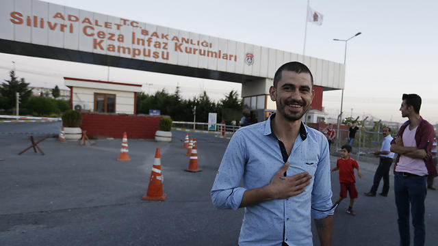 Emrah Pasa Alissoy, 27, thanks media after he was released from a high security prison complex in Silivri (Photo: AP)