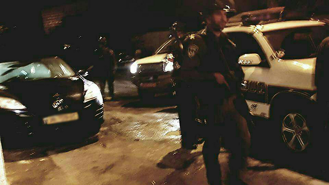 Security forces arresting Abdu for incitement