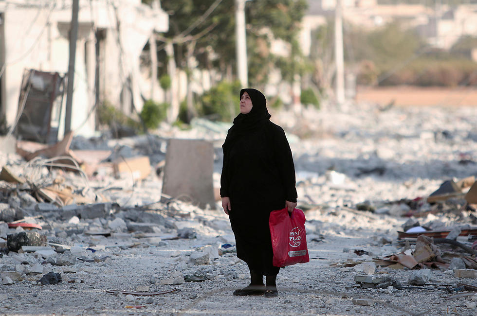 A Manbij resident walking through the city (Photo: Reuters)