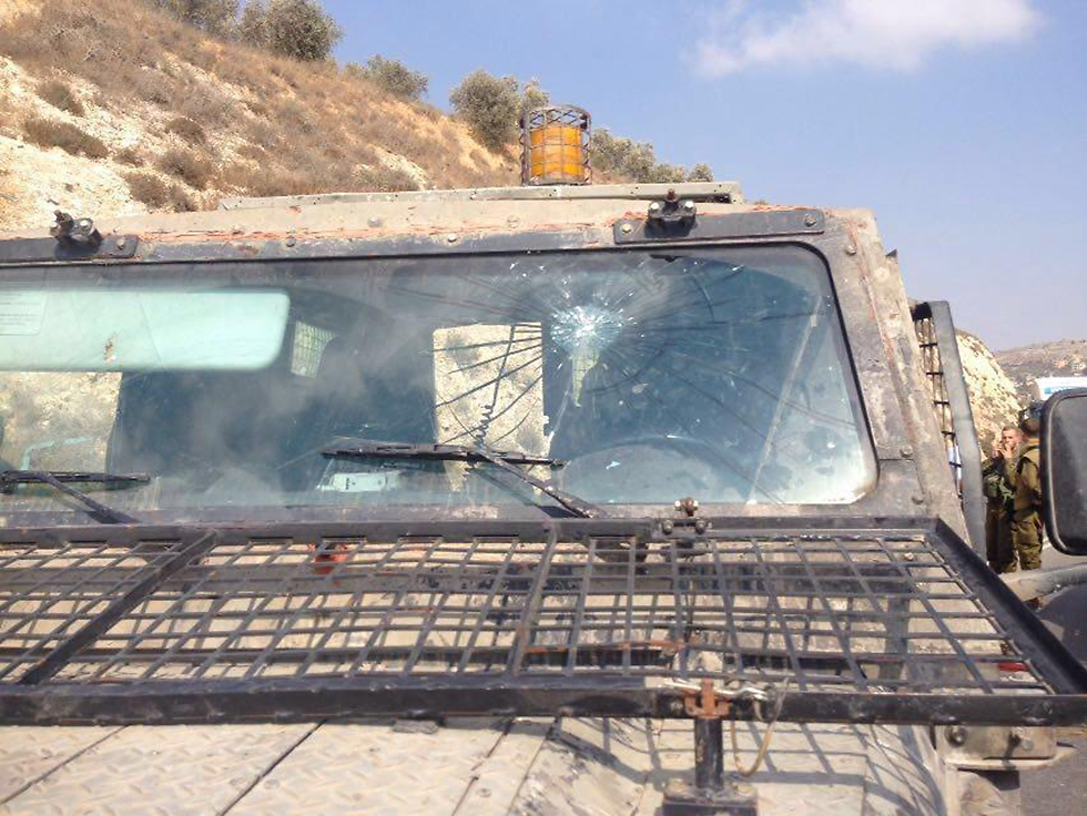 Rock hurled at military jeep
