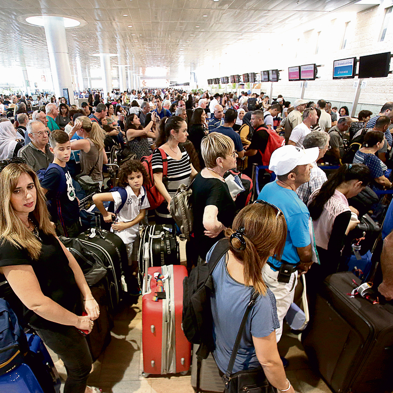 Passengers waiting in line at the airport