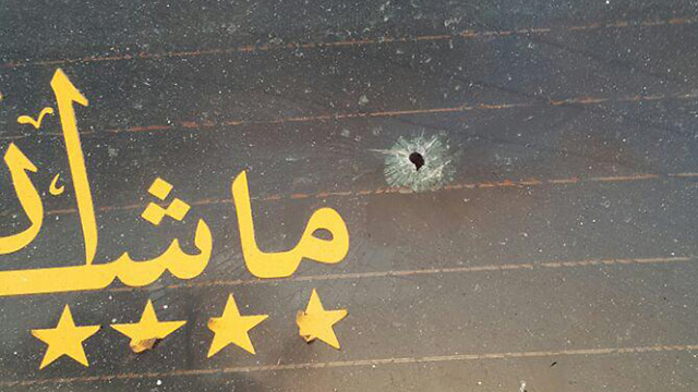 The damadged back windshield of the Palestinian cab. (Photo: Israel Police)