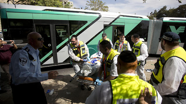  In this Tuesday, Oct. 13, 2015 file photo Israeli ZAKA emergency response members carry the body of an Israeli at the scene of a shooting attack in Jerusalem (Photo: AP)