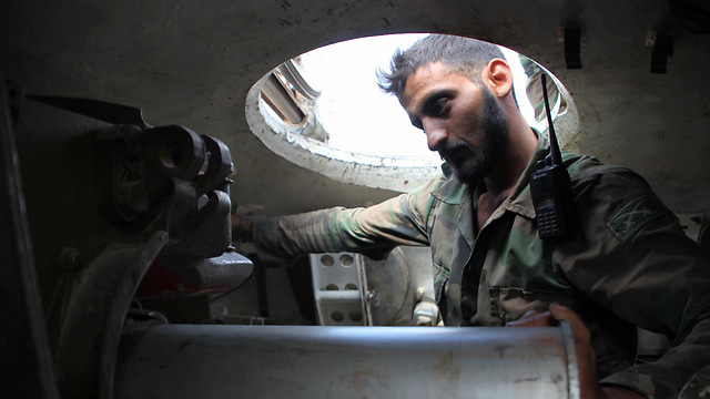 A Syrian soldier in a tank outside of Aleppo (Photo: AFP)