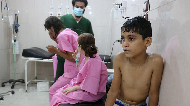 Wounded children in the Aleppo gas attack (Photo: AFP)