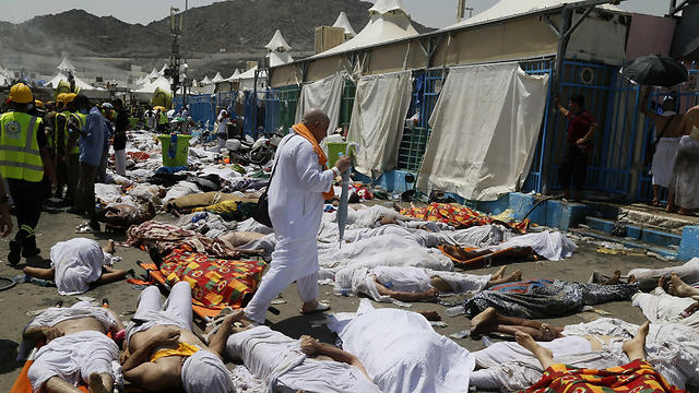 A man walks amongst the bodies of people killed in the 2015 hajj stampede (Photo: AP)