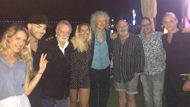 Lambert (second from left), Taylor and May (in the middle) out for dinner in Israel.