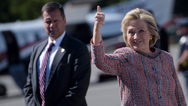 Secretary Clinton and a bodyguard. (Photo: AFP) (Photo: AFP)