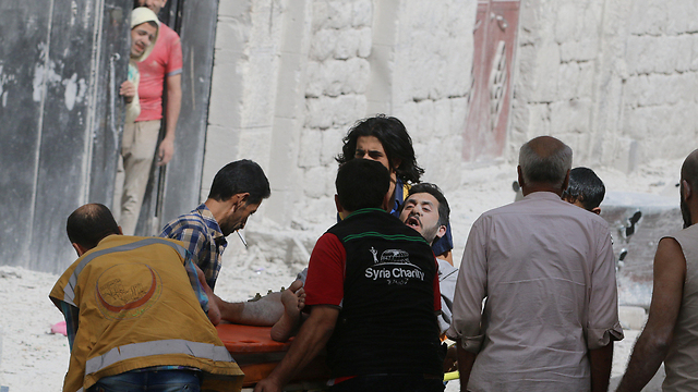 Evacuating the wounded from the wreckage in Aleppo following the recent onslaugh (Photo: Reuters)