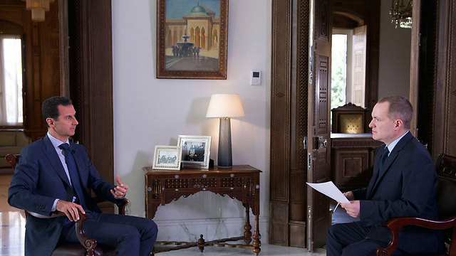L: Bashar al-Assad sits down for an interview with AP (Photo: AP)