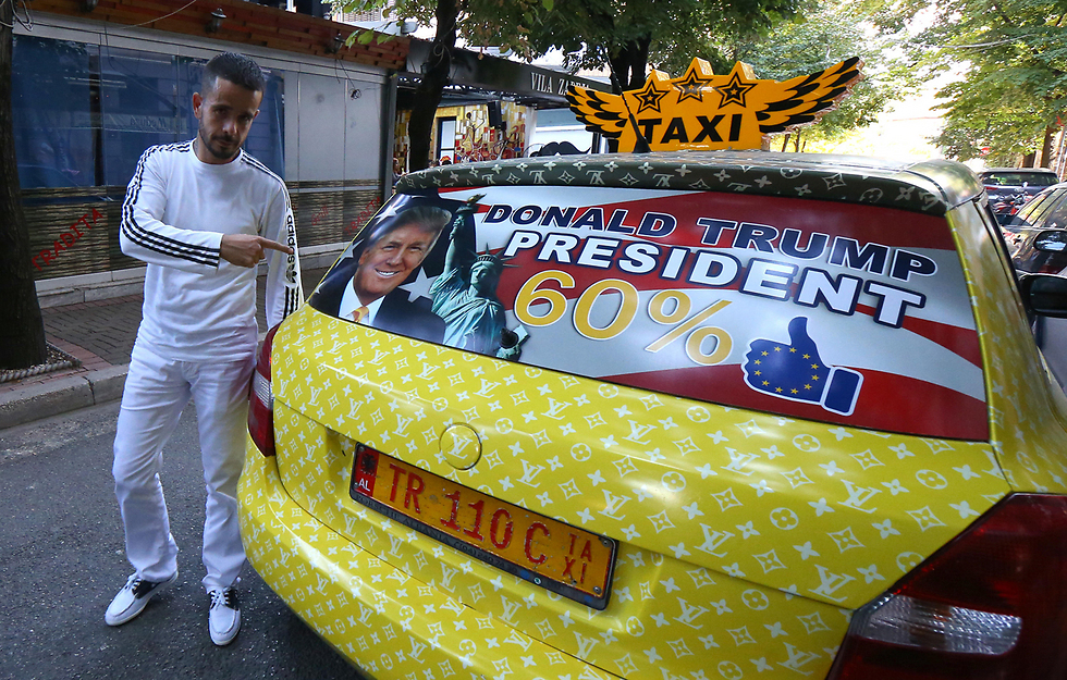 קולייגיה עם "מונית טראמפ". "מרוויח יותר מאי פעם (צילום: AP) (צילום: AP)